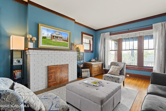 1400 W Main St, Jefferson City, MO 65101 - living area featuring ornamental molding, healthy amount of natural light, a fireplace, and light wood finished floors