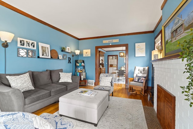 1400 W Main St, Jefferson City, MO 65101 - living room with wood finished floors, ornamental molding, and a fireplace