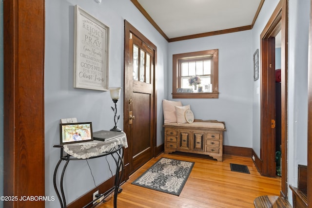 1400 W Main St, Jefferson City, MO 65101 - entryway featuring light wood-style flooring and crown molding