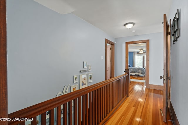 1400 W Main St, Jefferson City, MO 65101 - corridor featuring light wood finished floors and an upstairs landing