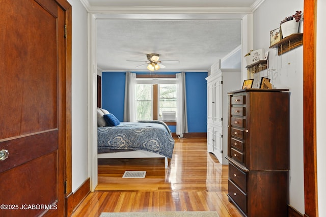 1400 W Main St, Jefferson City, MO 65101 - bedroom featuring wood finished floors, ornamental molding, and a ceiling fan