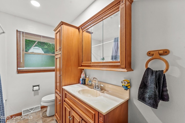 705 S Ravine St, Fulton, MO 65251 - bathroom featuring vanity, baseboards, and toilet