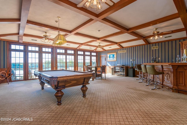 recreation room featuring beamed ceiling, a healthy amount of sunlight, light carpet, and billiards