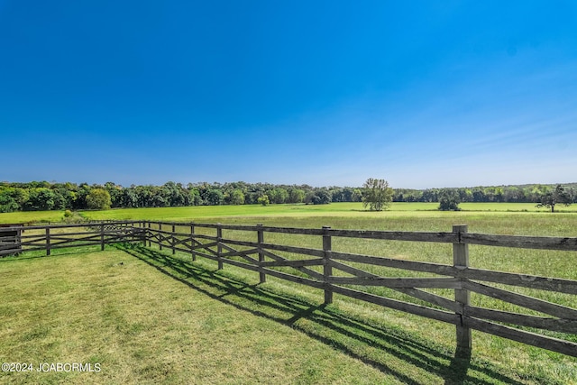 view of yard with a rural view