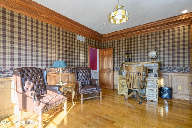 office featuring light hardwood / wood-style floors and ornamental molding