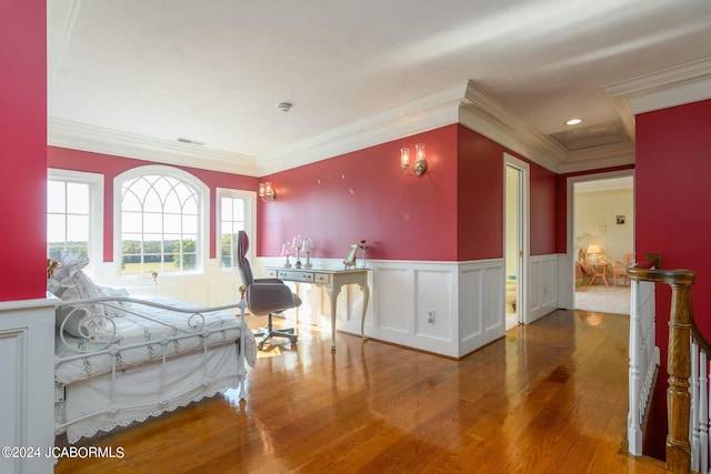 bedroom with hardwood / wood-style floors and crown molding