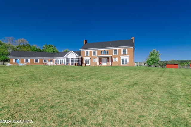 view of front of home with a front yard