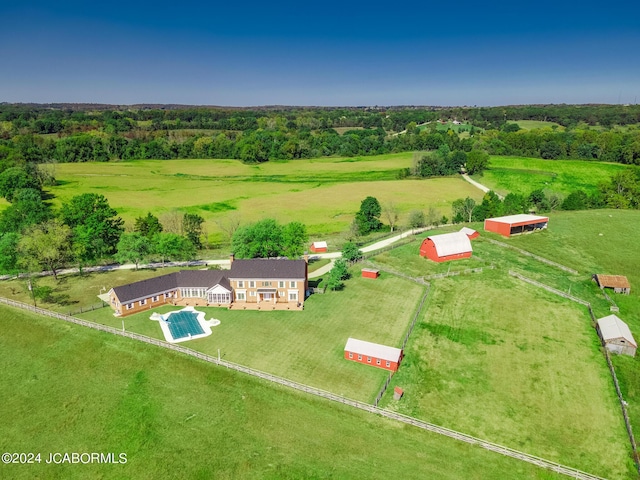 birds eye view of property with a rural view