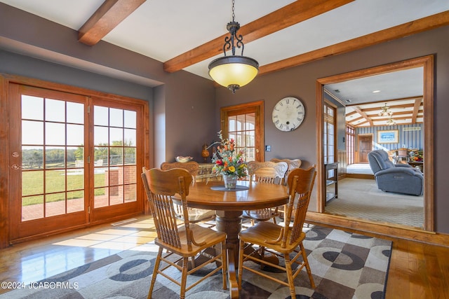 dining room featuring beamed ceiling