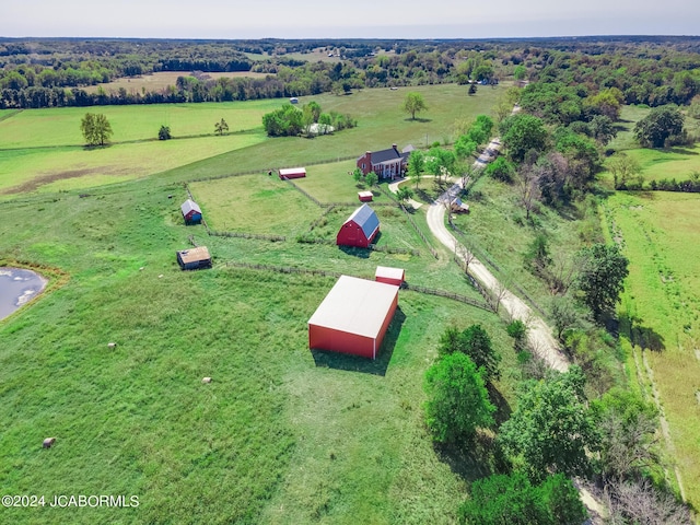 birds eye view of property with a rural view