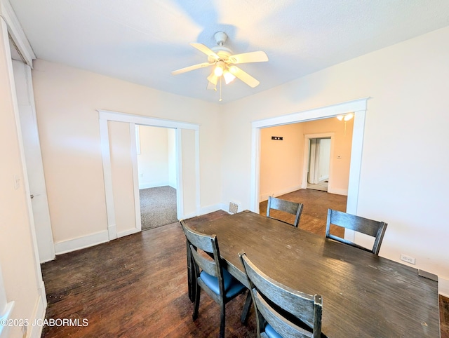 dining room featuring ceiling fan and dark hardwood / wood-style flooring