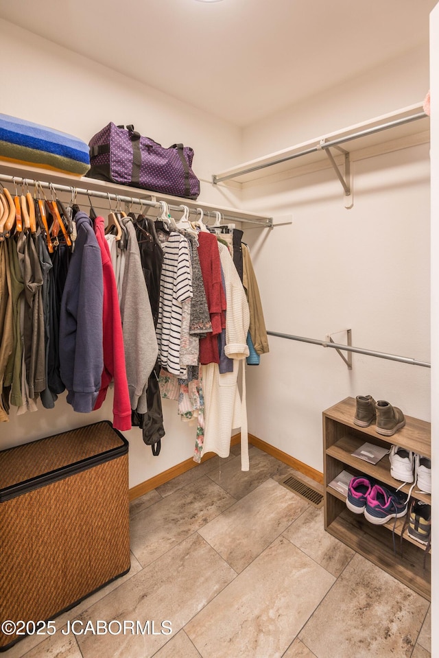 walk in closet with visible vents