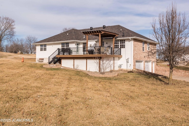 rear view of house featuring a lawn, an attached garage, a wooden deck, and a pergola