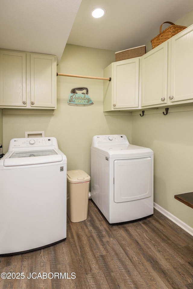 washroom featuring dark wood finished floors, recessed lighting, cabinet space, separate washer and dryer, and baseboards