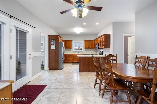 dining area featuring light tile patterned floors, a ceiling fan, and recessed lighting