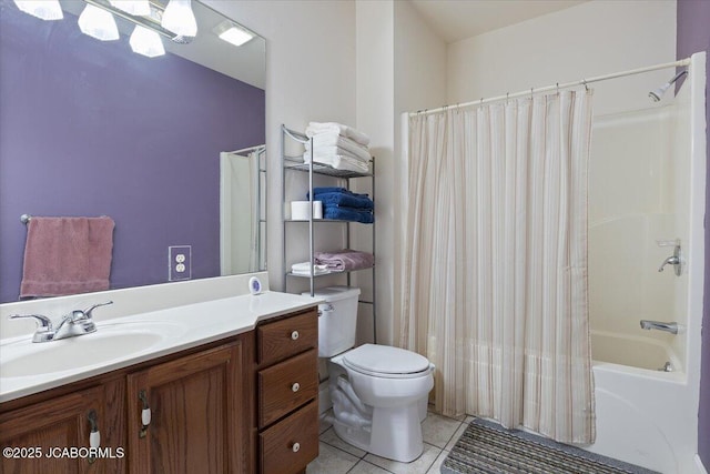 bathroom with tile patterned flooring, vanity, toilet, and shower / bath combo with shower curtain