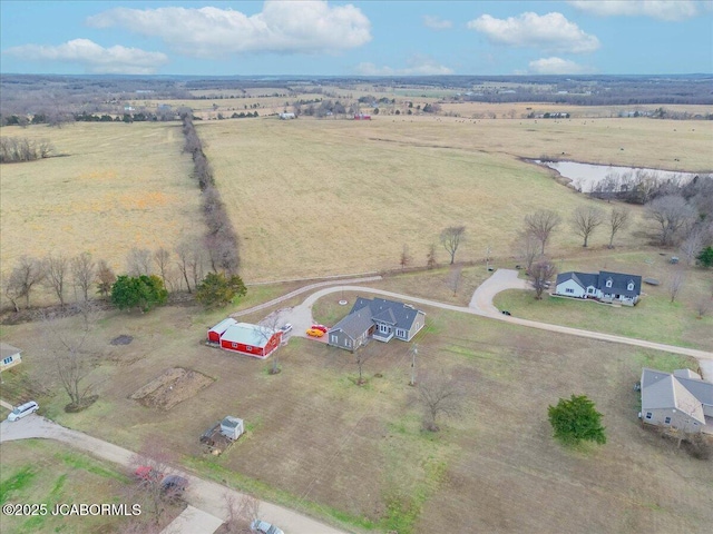 birds eye view of property featuring a rural view