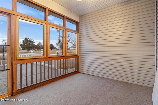 unfurnished sunroom featuring a healthy amount of sunlight