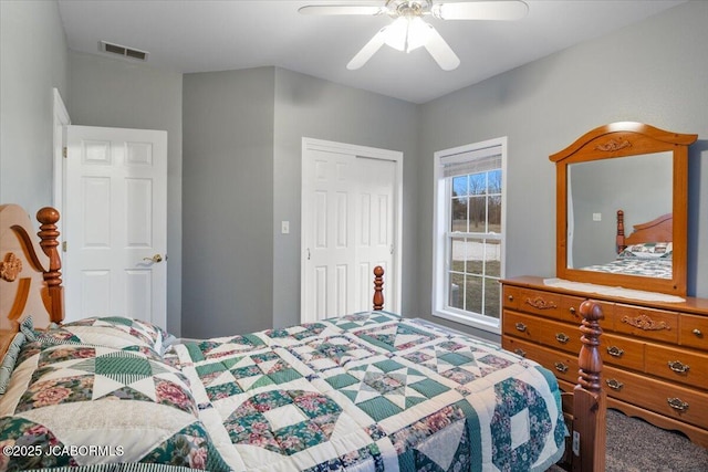 bedroom featuring a closet, visible vents, and ceiling fan