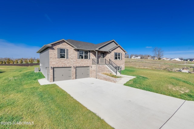 view of front of house featuring a front yard and a garage