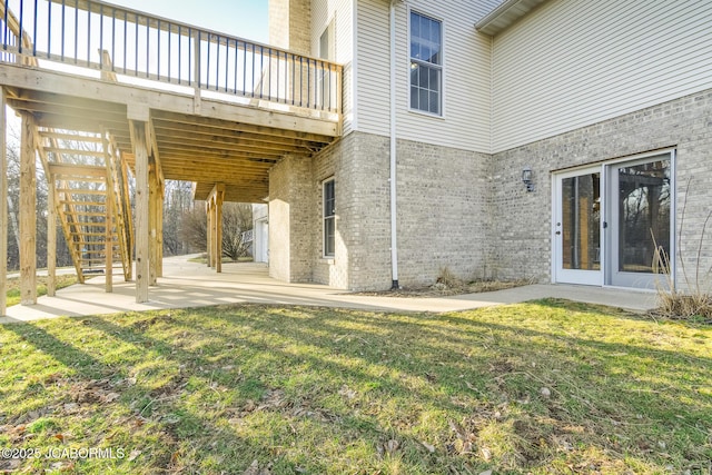 view of yard with stairway and a patio