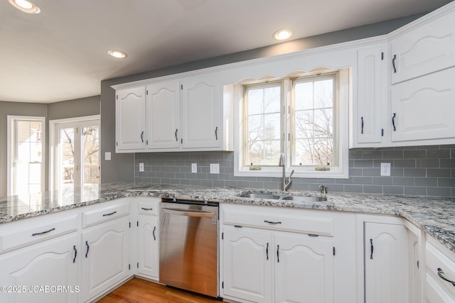 kitchen featuring recessed lighting, a sink, a healthy amount of sunlight, and stainless steel dishwasher