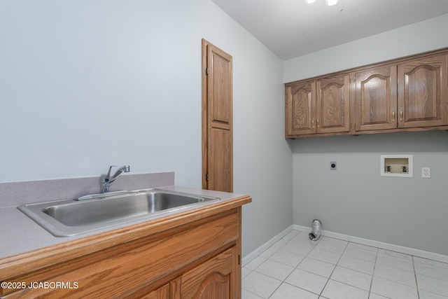 washroom featuring light tile patterned flooring, cabinet space, a sink, washer hookup, and electric dryer hookup