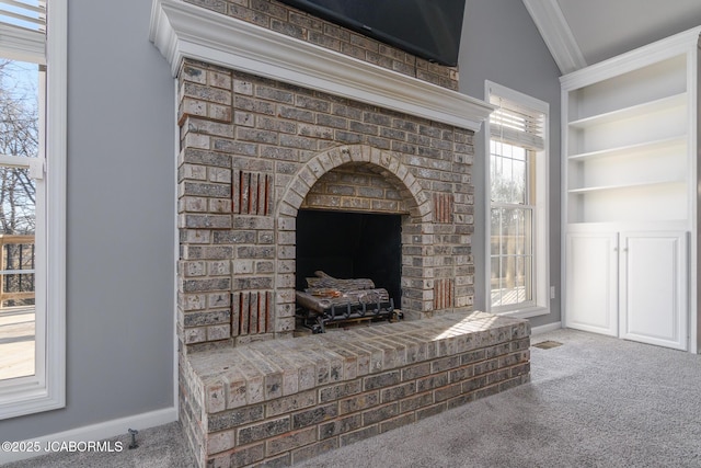 details featuring built in features, ornamental molding, baseboards, and carpet floors