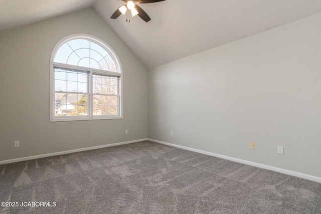 carpeted empty room with baseboards, a ceiling fan, and vaulted ceiling