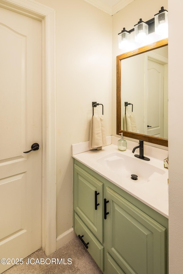 bathroom with vanity and ornamental molding