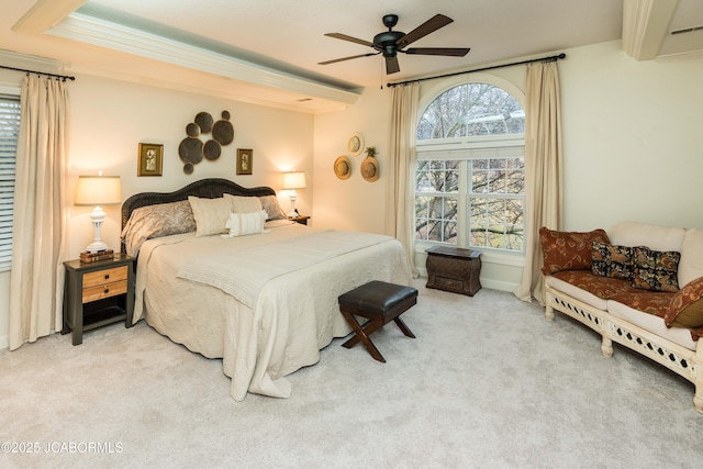 carpeted bedroom featuring crown molding and ceiling fan