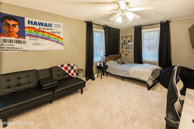 carpeted bedroom featuring ceiling fan