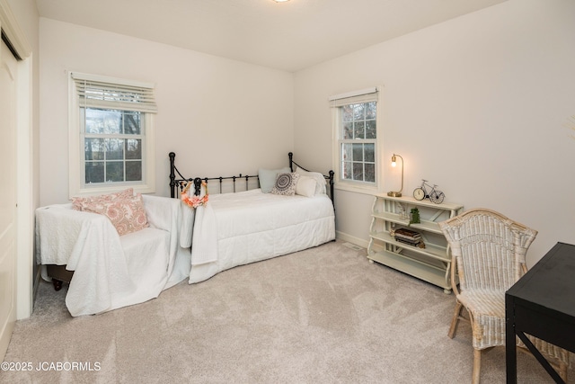 bedroom featuring an AC wall unit and carpet flooring