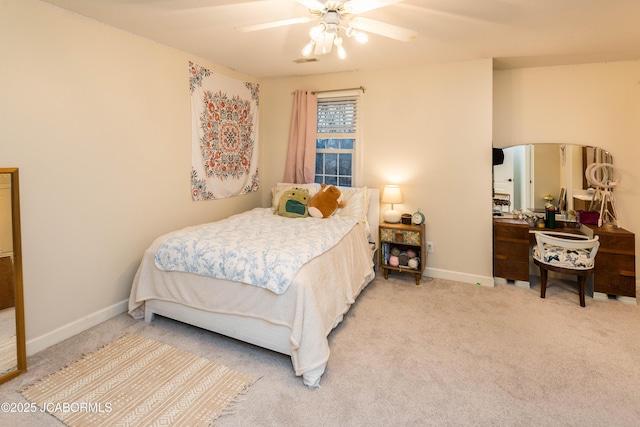 bedroom with ceiling fan and carpet floors