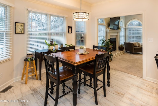 dining room with crown molding