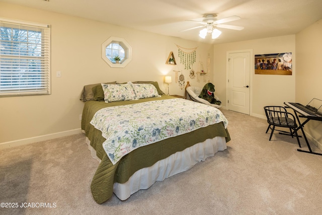 bedroom with ceiling fan, multiple windows, and carpet