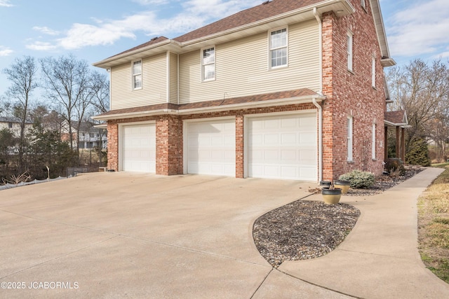 view of side of property with a garage