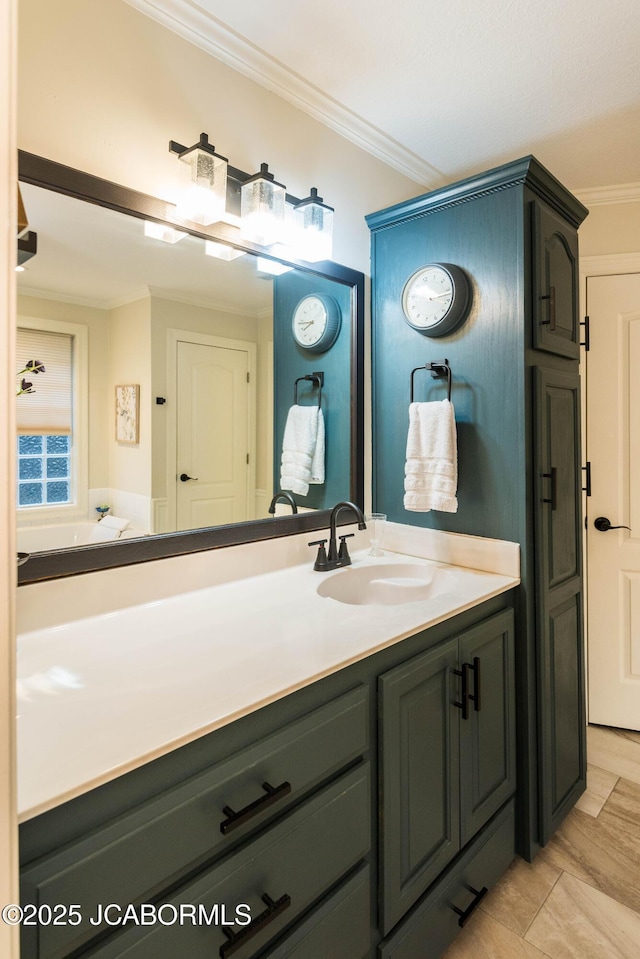 bathroom featuring crown molding and vanity