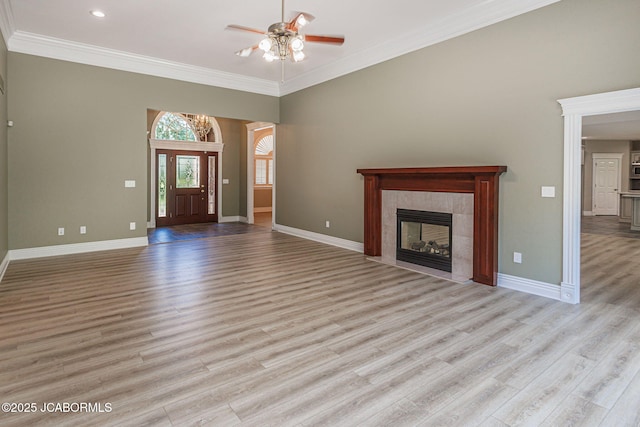 4205 Grant Ln, Columbia, MO 65203 - unfurnished living room featuring a ceiling fan, wood finished floors, ornamental molding, and a tile fireplace