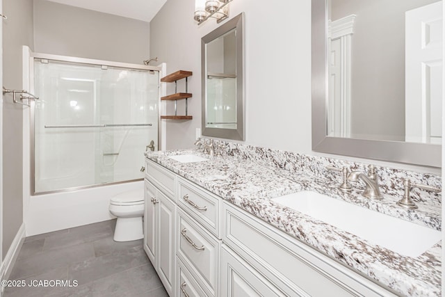 4205 Grant Ln, Columbia, MO 65203 - full bath featuring double vanity, shower / bath combination with glass door, and tile patterned floors