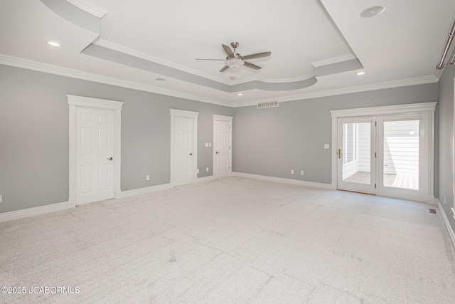 4205 Grant Ln, Columbia, MO 65203 - unfurnished bedroom featuring a raised ceiling, access to exterior, crown molding, light colored carpet, and recessed lighting