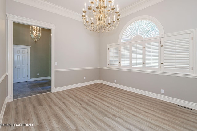 4205 Grant Ln, Columbia, MO 65203 - spare room featuring a chandelier, light wood-type flooring, and ornamental molding