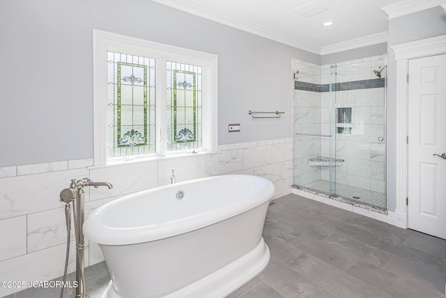 4205 Grant Ln, Columbia, MO 65203 - full bathroom featuring tile walls, a soaking tub, a stall shower, crown molding, and wainscoting