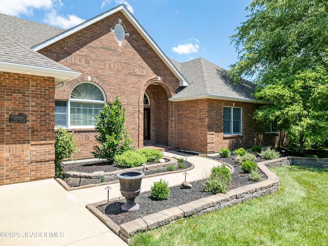 4205 Grant Ln, Columbia, MO 65203 - view of front of home featuring brick siding, roof with shingles, and a front lawn