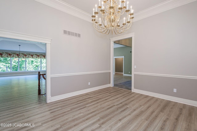 4205 Grant Ln, Columbia, MO 65203 - unfurnished room featuring a chandelier, wood finished floors, and crown molding