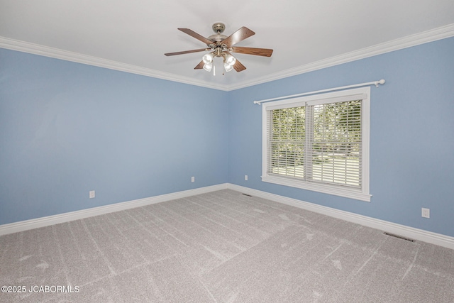 4205 Grant Ln, Columbia, MO 65203 - spare room with crown molding, carpet, and ceiling fan