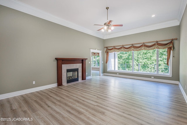 4205 Grant Ln, Columbia, MO 65203 - unfurnished living room featuring a ceiling fan, light wood-style flooring, a fireplace, crown molding, and recessed lighting