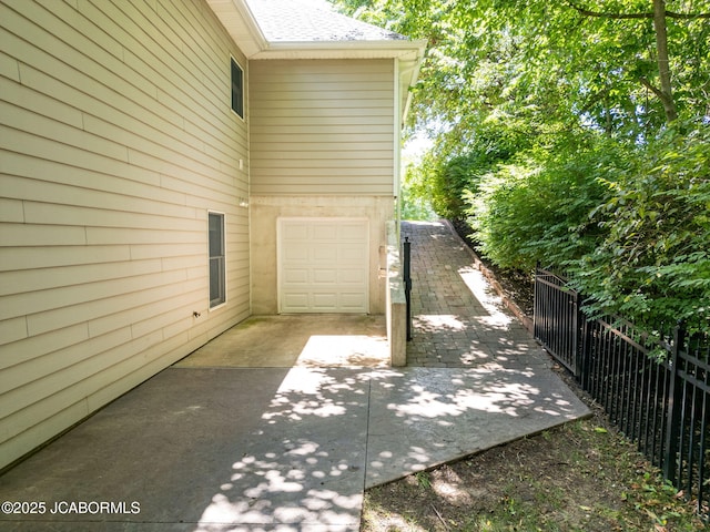 4205 Grant Ln, Columbia, MO 65203 - view of patio with a garage and driveway