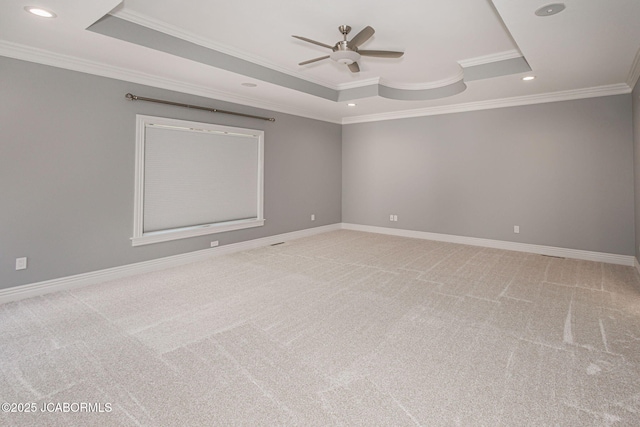 4205 Grant Ln, Columbia, MO 65203 - unfurnished room featuring a tray ceiling, ornamental molding, ceiling fan, light colored carpet, and recessed lighting