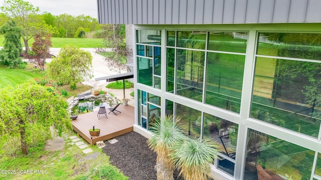 view of home's exterior featuring a wooden deck